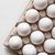 close up of white eggs in carton