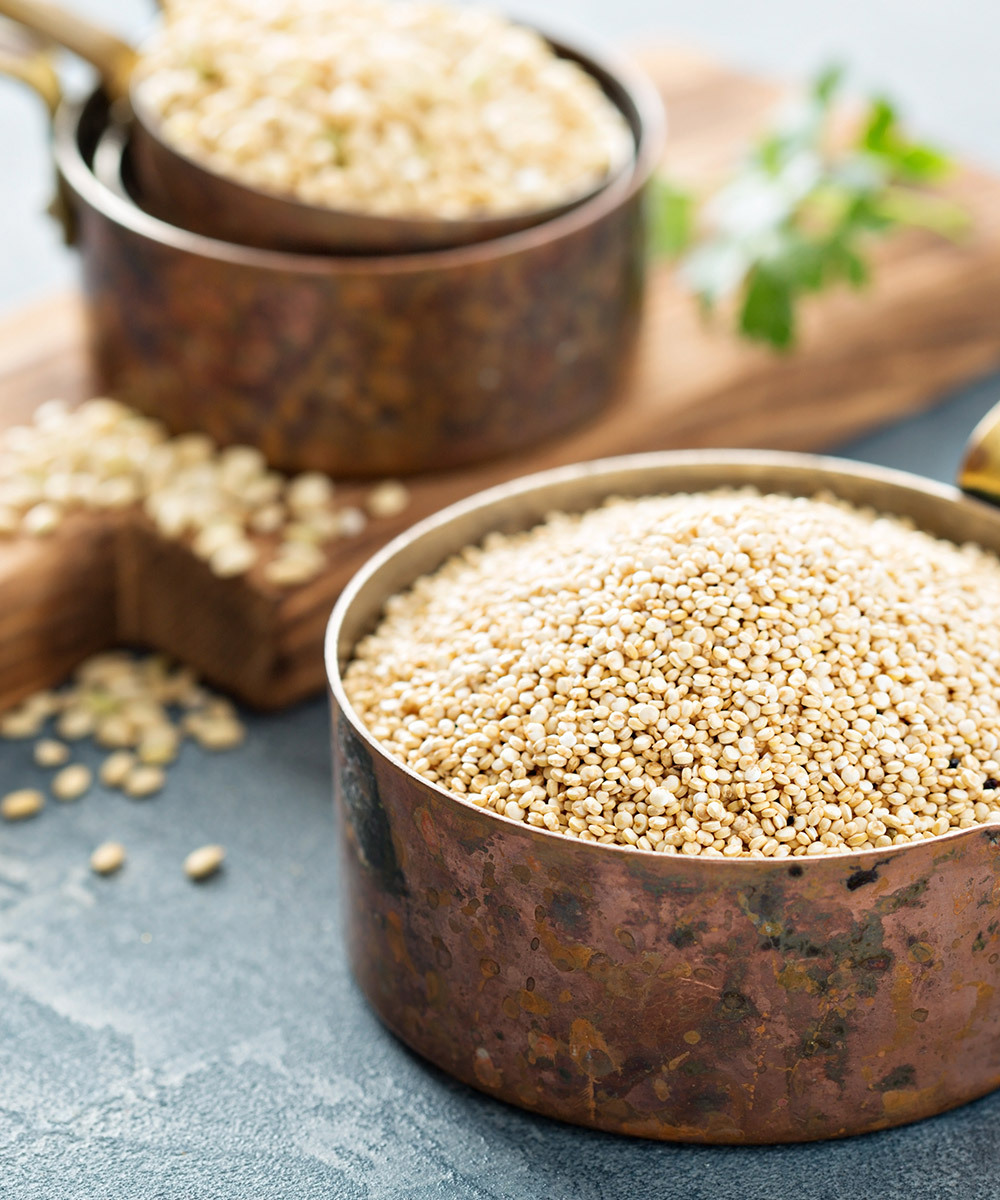 Copper pots filled with quinoa
