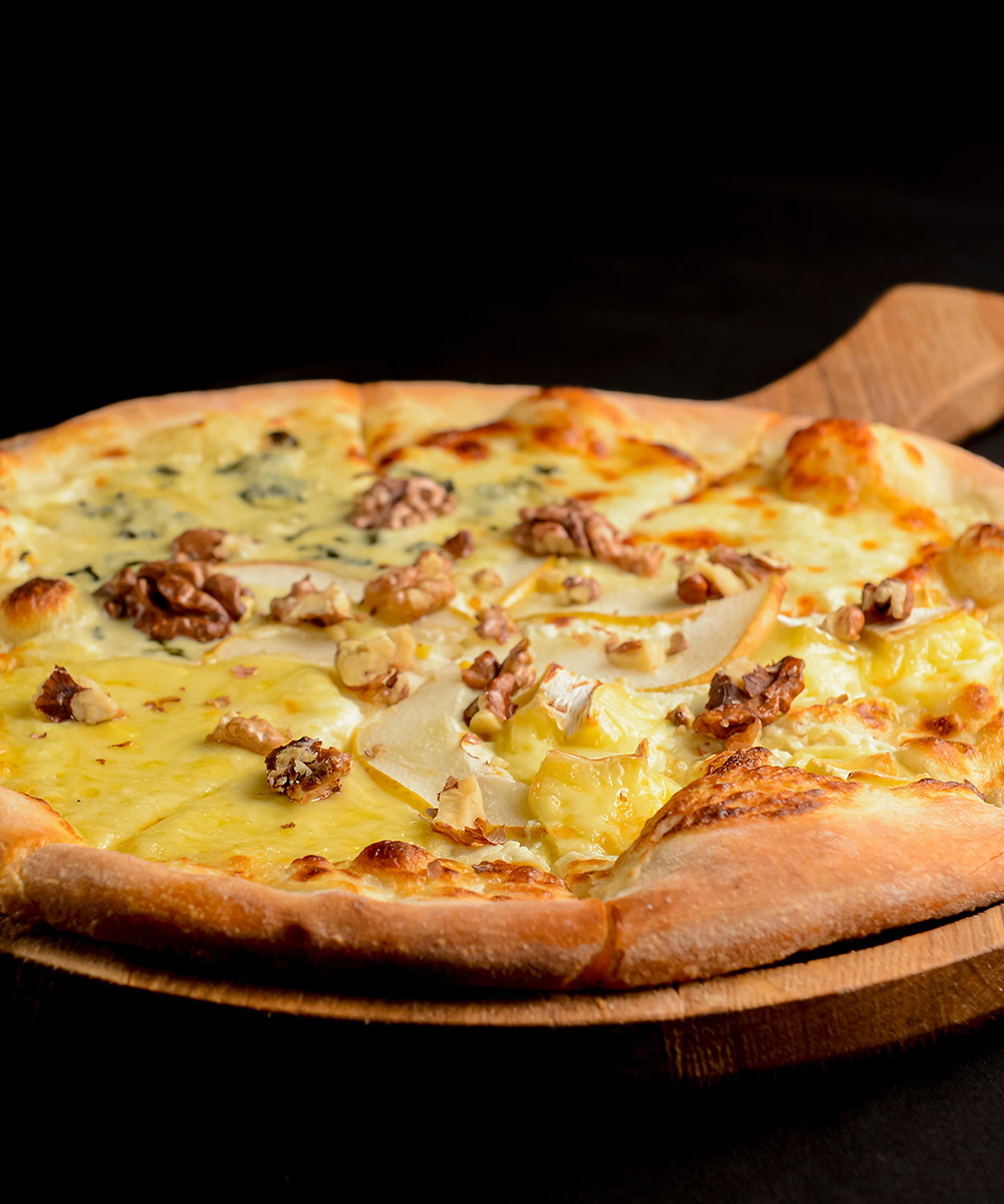 Flatbread topped with turkey and scrambled eggs