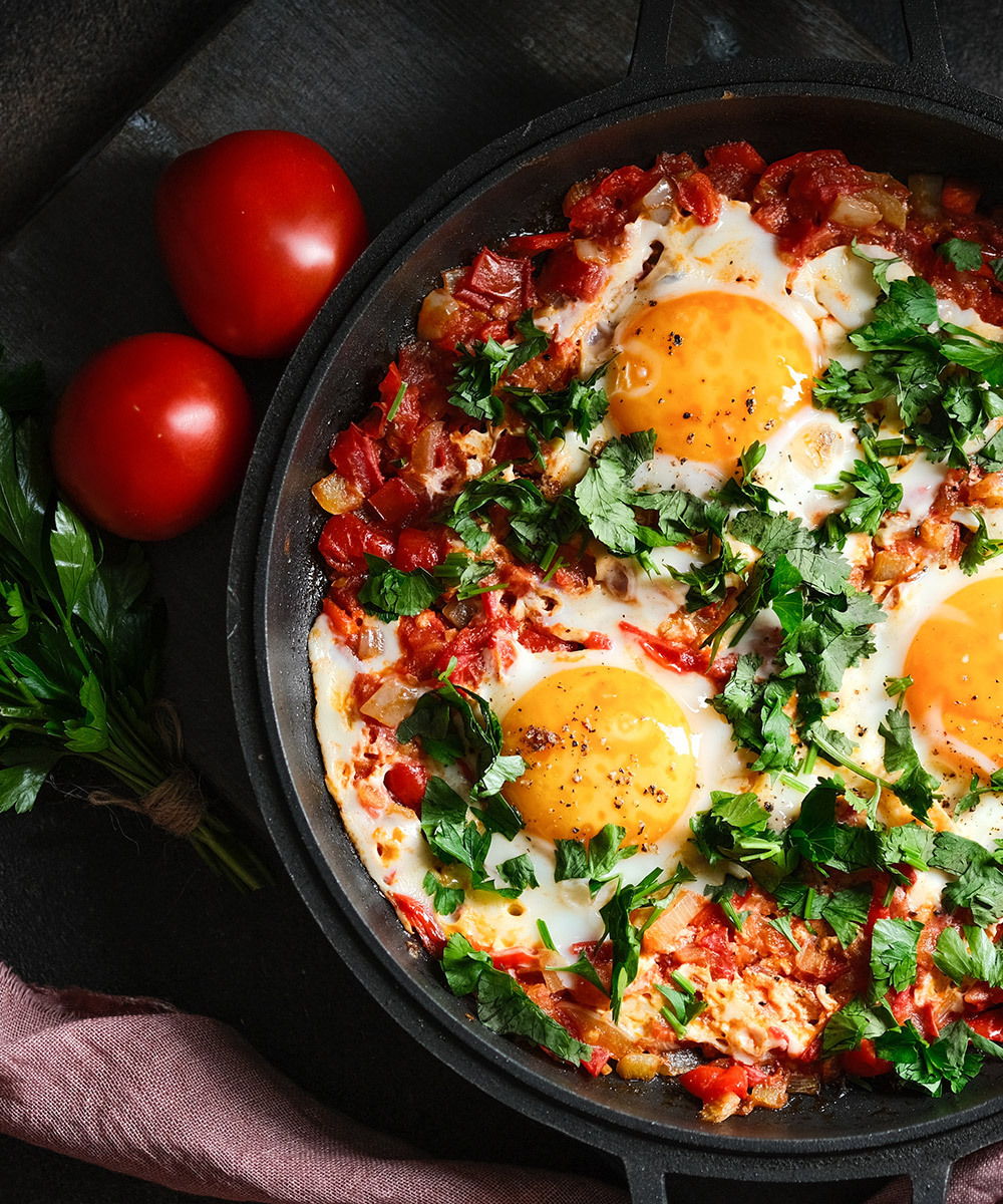 Shakshuka served in a cast iron pan