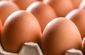 Close up of brown eggs in a large egg carton