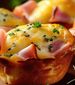 Close up of cheesy ham and egg muffins
