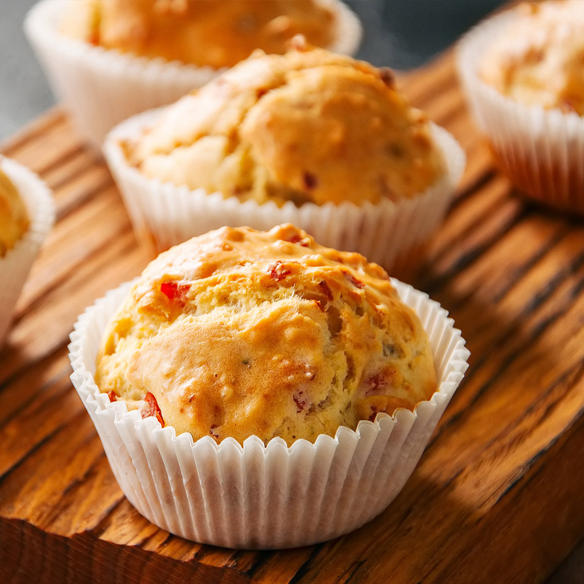 A close up look of a bacon cheddar muffin