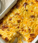 Cheesy breakfast strata with bacon and eggs.