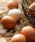 Close up of brown eggs and white eggs on table